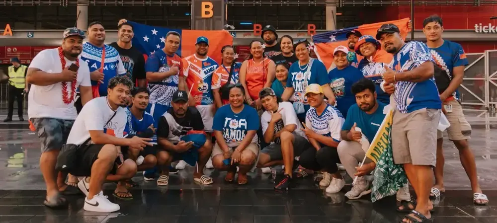 The TRAILS community together, Samoan flags raised at a Toa Samoa match