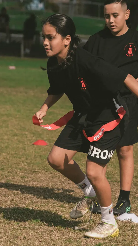 Two players in flag belts during a drill