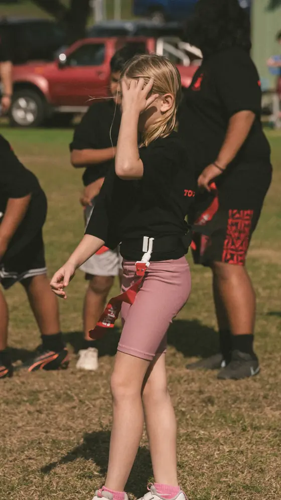 A young participant on the sideline